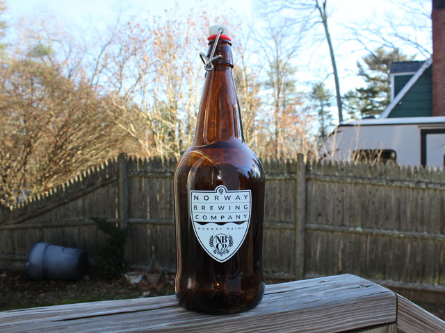 A 32oz glass growler from Norway Brewing Company in Norway, ME
