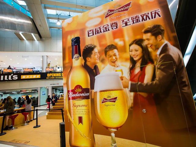 An advertisement featuring a bottle of Budweiser Supreme.