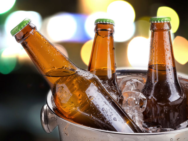 Three beers placed in a bath of ice water