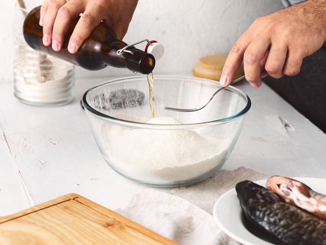 A Chef making the beer batter for fish