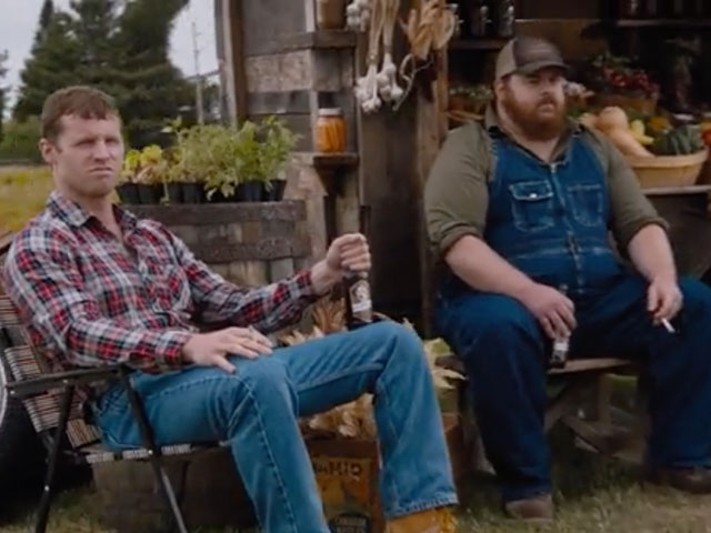 Wayne and Squirrely Dan drinking bottles of cold Puppers Golden Lager at the Produce Stand